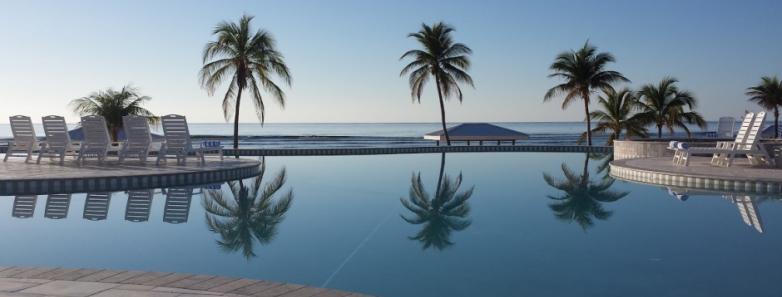 A daytime view of the pool at Cayman Brac Beach Resort