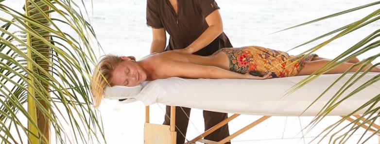 A woman receives a massage at Cayman Brac Beach Resort