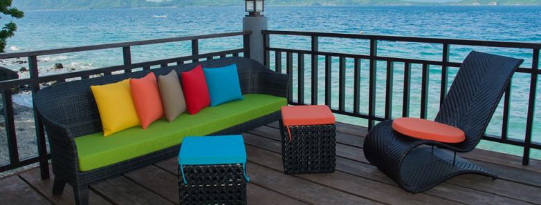 A seating area on a deck overlooking the ocean at Crystal Blue Resort, Anilao.