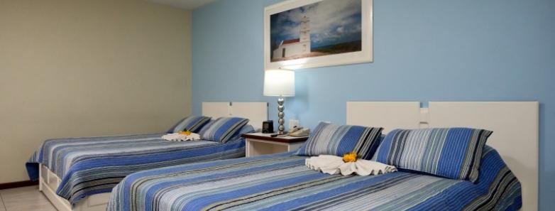 Two queen beds in a Deluxe Ocean View Room at Captain Don's Habitat in Bonaire
