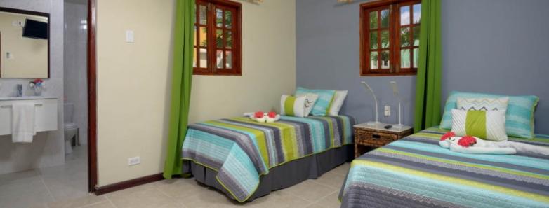 Bedroom and ensuite in a 3 bed bungalow at Captain Don's Habitat dive resort in Bonaire