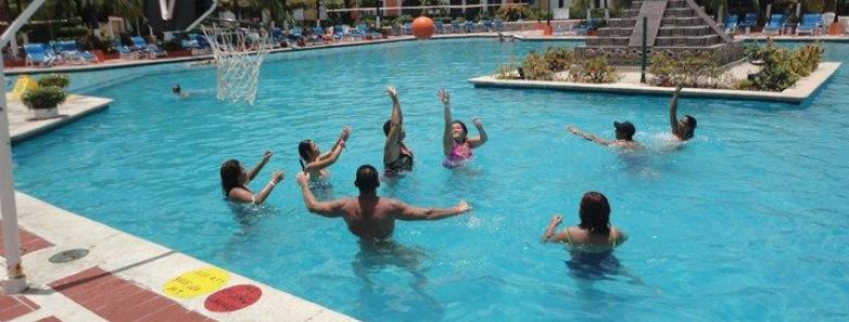 People having a blast playing in the pool at the Cozumel Palace resort!