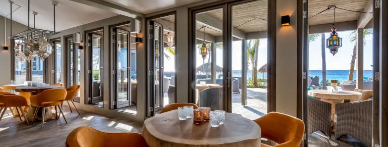 A modern restaurant interior at Delfins Beach Resort Bonaire.
