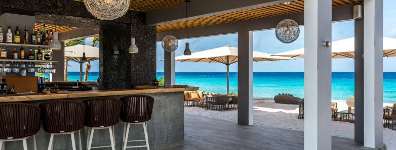 A bar overlooks the ocean at Delfins Beach Resort Bonaire.