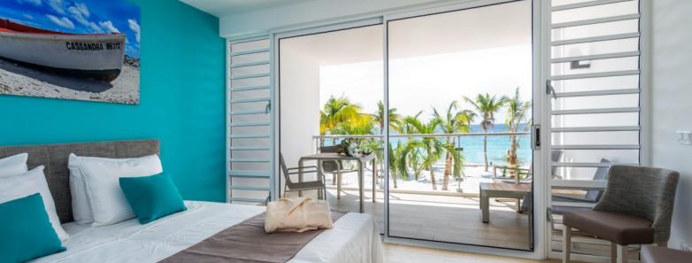 A modern studio bedroom at Delfins Beach Resort Bonaire.