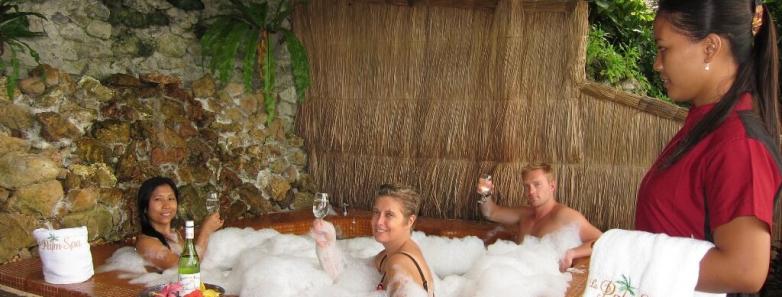 People drink wine in a bubble bath at the spa at El Galleon