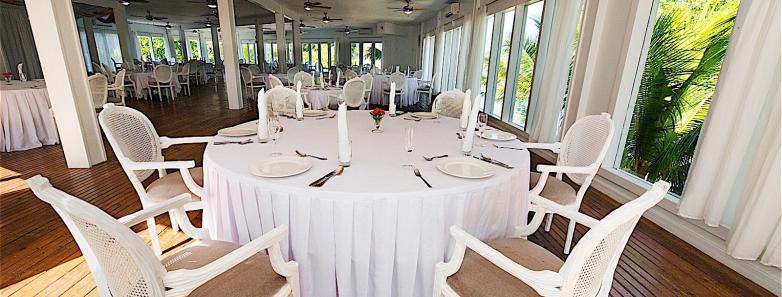 Tables set for dining at Fantasy Island Roatan Resort.