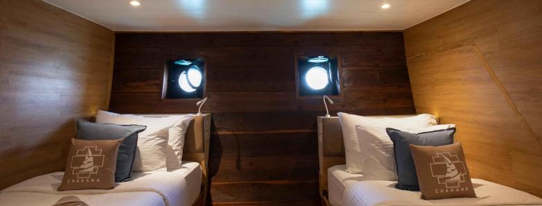 Twins bed in cabin below deck