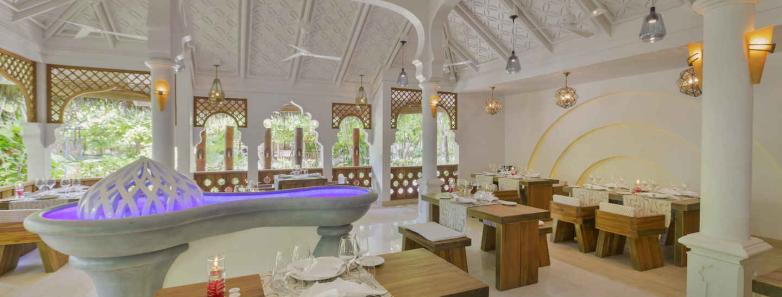 A spacious restaurant with a big dining area at Kuramathi Island Resort Maldives.