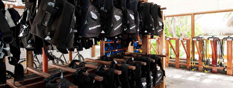 Scuba diving equipment hangs at Kuramathi Island Resort Maldives.