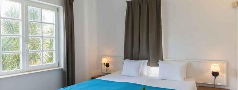 Bedroom in a standard apartment at Livingstone Jan Thiel Beach Resort
