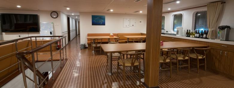 The indoor dining area aboard the White Manta liveaboard