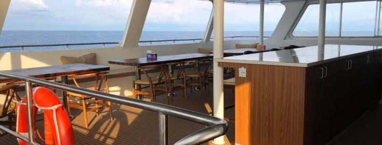 Outdoor dining area on the White Manta liveaboard