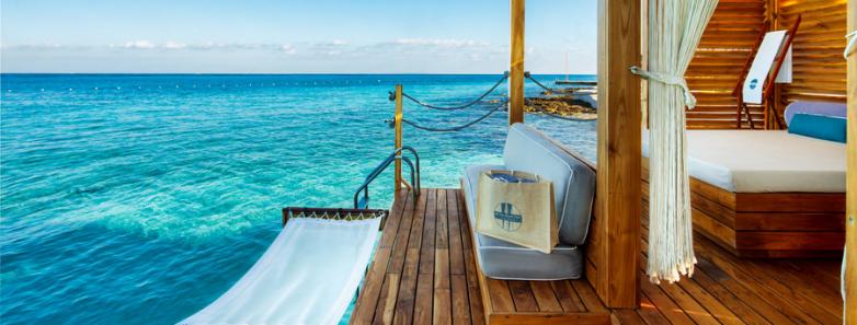 A hammock and over-water cabana at Presidente Intercontinental Resort & Spa in Cozumel, Mexico.