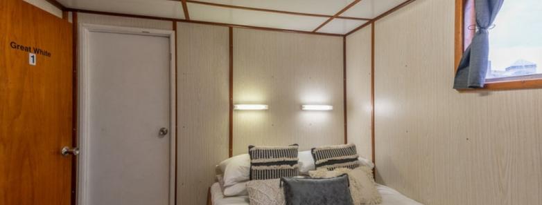 A bed in a cabin of one of the Rodney Fox Shark Expeditions vessels