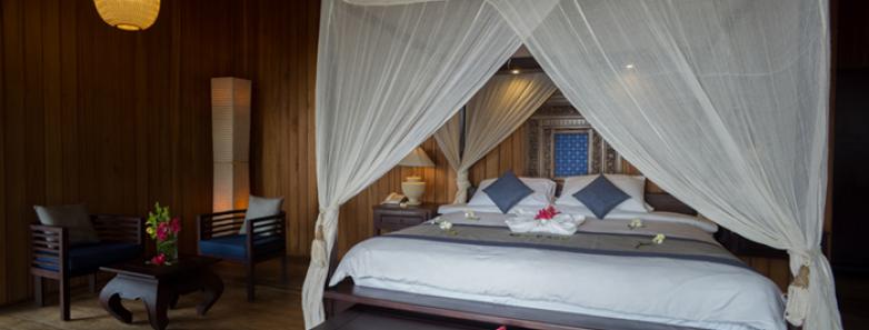 Bedroom of a beach view villa at Siladen Resort & Spa Bunaken
