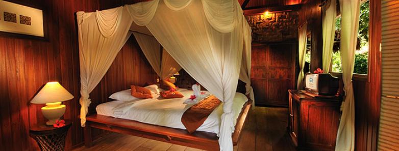 Bedroom in a garden view villa at Siladen Resort & Spa Bunaken