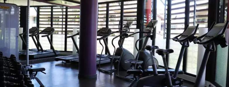 Cardio exercise machines in a gym at Te Moana Tahiti Resort