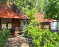 External view of rustic bungalows at Motu Aito Paradise