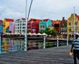 People walk down a street in Willemstad, Curacao
